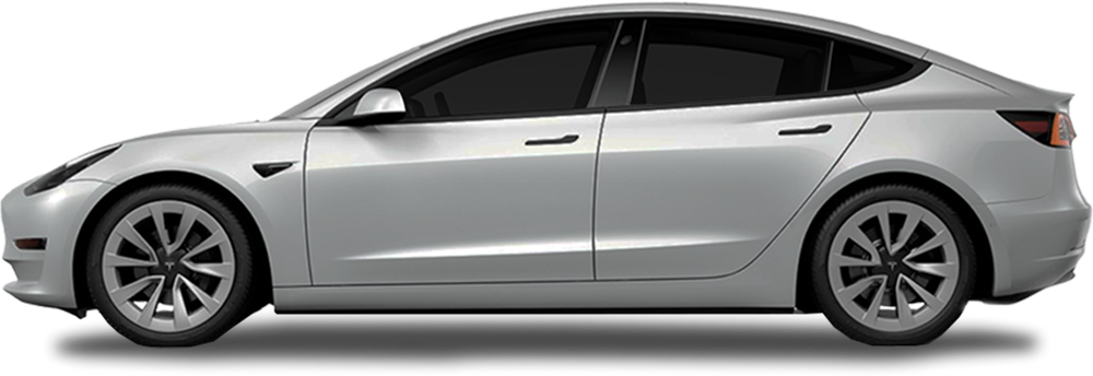Silver Tesla Model 3 viewed from the side with dark tinted windows and aerodynamic styling.