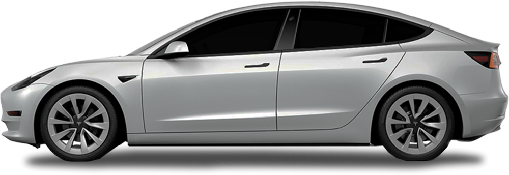 Driver-side view of a silver Tesla Model 3 with dark-tinted windows and a clean, modern body design.